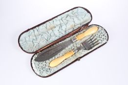 A CASED PAIR OF LATE VICTORIAN IVORY-HANDLED SILVER-PLATED FISH SERVERS