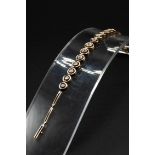 AN 18CT GOLD AND DIAMOND BRACELET