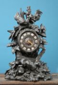 A BLACK FOREST CARVED OAK MANTEL CLOCK, LATE 19th CENTURY