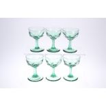 A SET OF SIX LATE VICTORIAN GREEN-GLASS CHAMPAGNE BOWLS