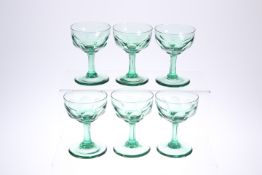 A SET OF SIX LATE VICTORIAN GREEN-GLASS CHAMPAGNE BOWLS