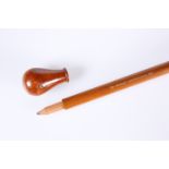 A NOVELTY WOODEN WALKING STICK WITH CONCEALED PENCIL