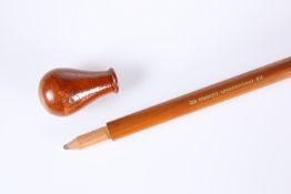 A NOVELTY WOODEN WALKING STICK WITH CONCEALED PENCIL