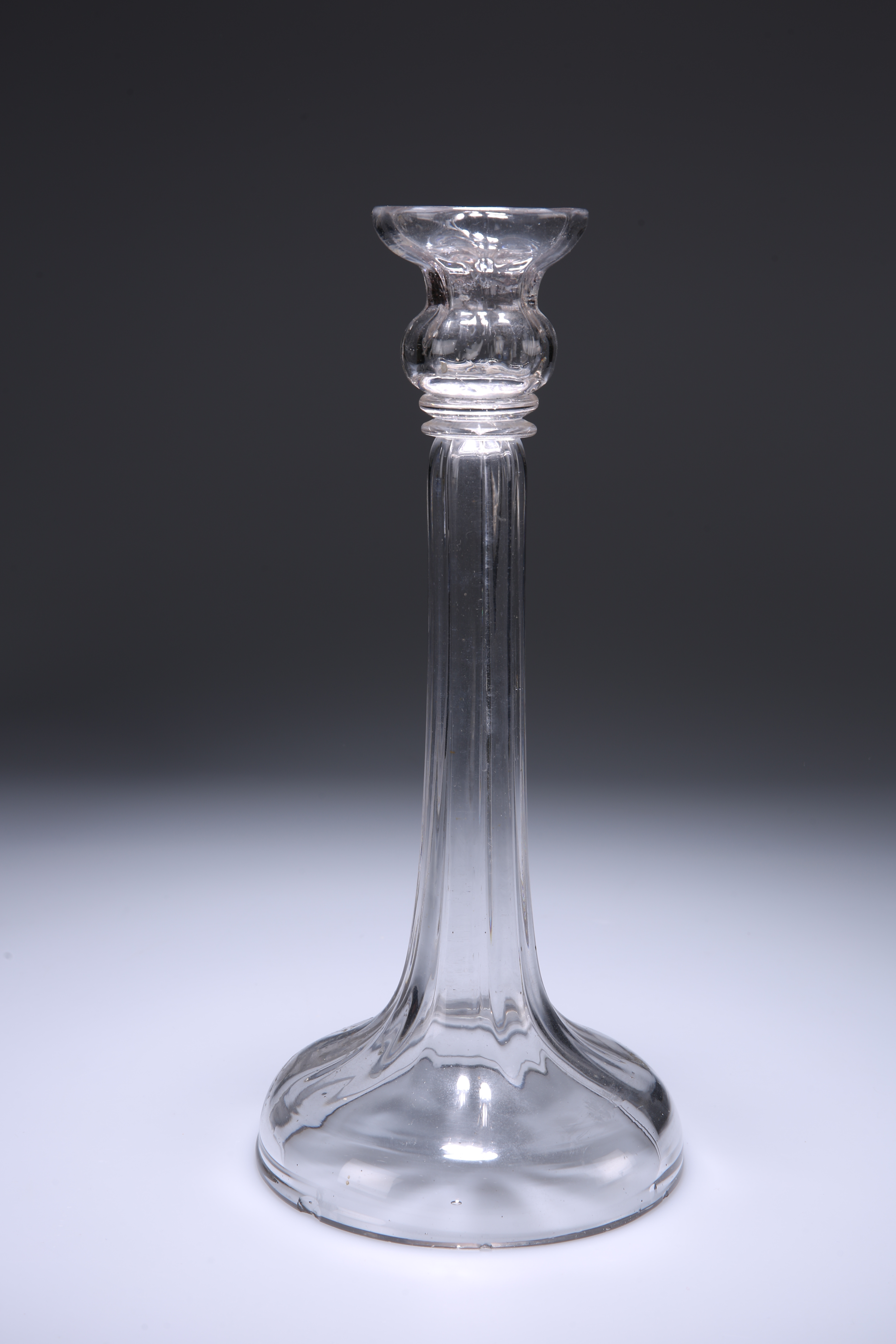 AN 18TH CENTURY HOLLOW-STEM GLASS CANDLESTICK