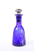 A LATE VICTORIAN CUT BLUE GLASS LIQUEUR DECANTER