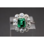 AN EMERALD AND DIAMOND RING