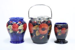 THREE PIECES OF MOORCROFT POTTERY IN THE POMEGRANATE PATTERN