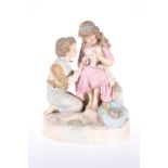 A ROBINSON & LEADBEATER TINTED PARIAN GROUP OF TWO CHILDREN