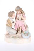 A ROBINSON & LEADBEATER TINTED PARIAN GROUP OF TWO CHILDREN