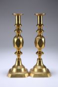 A PAIR OF VICTORIAN ACE OF DIAMONDS BRASS CANDLESTICKS