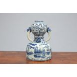 A CHINESE BLUE AND WHITE TWO-HANDLED GOURD VASE