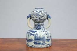 A CHINESE BLUE AND WHITE TWO-HANDLED GOURD VASE