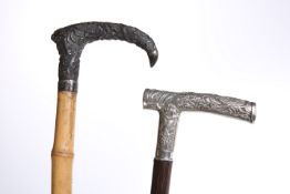 TWO CHINESE WHITE-METAL HANDLED WALKING STICKS