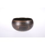 AN ISLAMIC COPPER TUMBLER BOWL