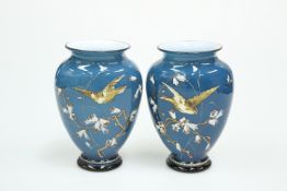 A PAIR OF VICTORIAN ENAMEL PAINTED BLUE CASED GLASS VASES