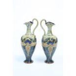 A PAIR OF ROYAL DOULTON STONEWARE EWERS, CIRCA 1902-1922