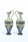 A PAIR OF ROYAL DOULTON STONEWARE EWERS, CIRCA 1902-1922