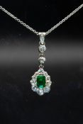 AN EMERALD AND DIAMOND PENDANT