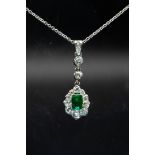 AN EMERALD AND DIAMOND PENDANT