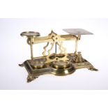 A SET OF VICTORIAN BRASS POSTAL SCALES