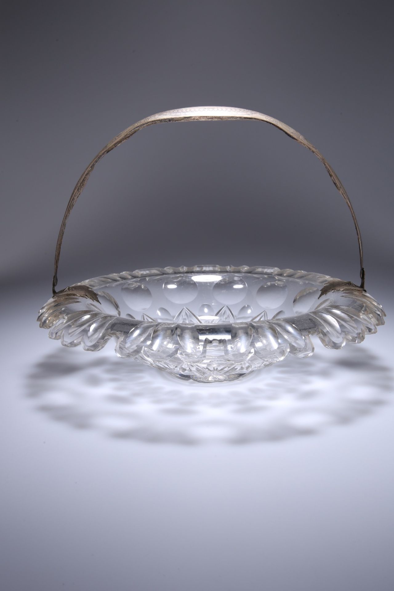 A MID-19th CENTURY WHITE METAL MOUNTED CUT-GLASS BASKET