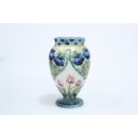 WILLIAM MOORCROFT FOR JAMES MACINTYRE & CO, A "ROSE AND TULIP" PATTERN VASE