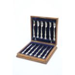 A SET OF SIX EDWARDIAN SILVER-HANDLED DESSERT KNIVES AND FORKS