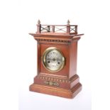 A JUNGHANS WALNUT CASED MANTEL CLOCK, CIRCA 1900
