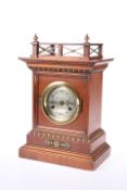 A JUNGHANS WALNUT CASED MANTEL CLOCK, CIRCA 1900