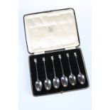 A SET OF SIX "LINCOLN IMP" SILVER SPOONS, JAMES USHER & SON