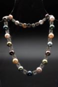 A CULTURED PEARL AND DIAMOND NECKLACE