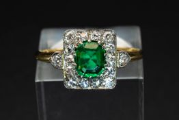 AN EMERALD AND DIAMOND RING