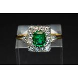 AN EMERALD AND DIAMOND RING