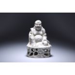 A CHINESE BLANC DE CHINE PORCELAIN FIGURE OF A SEATED BUDDHA