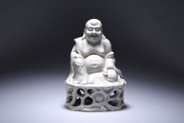 A CHINESE BLANC DE CHINE PORCELAIN FIGURE OF A SEATED BUDDHA