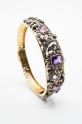 A MID 19TH CENTURY DIAMOND AND AMETHYST SET BANGLE