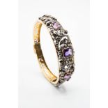 A MID 19TH CENTURY DIAMOND AND AMETHYST SET BANGLE