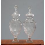 A LARGE PAIR OF ADAM STYLE GLASS URNS AND COVERS