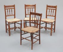 THREE RUSH-SEATED OAK CHAIRS AND SIMULATED ROSEWOOD CHAIR