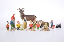 A SET OF PAINTED METAL FIGURES OF SNOW WHITE AND THE SEVEN DWARFS