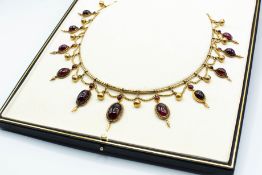 A MID VICTORIAN GARNET SET FRINGE NECKLACE