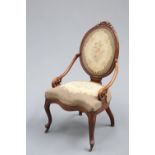 A VICTORIAN WALNUT AND UPHOLSTERED PANEL-BACK DRAWING ROOM CHAIR