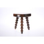 A 19th CENTURY GRAIN-PAINTED TREEN CANDLE STAND