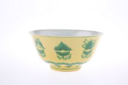 A CHINESE YELLOW GROUND AND GREEN DECORATED BOWL