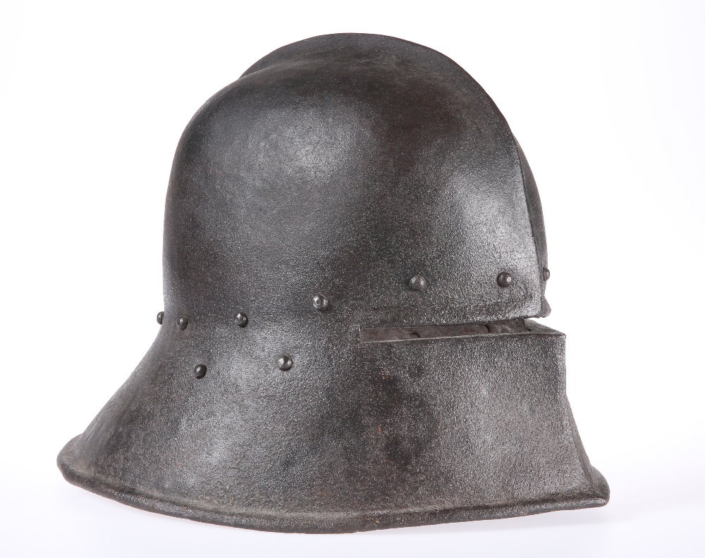 A SALLET, with raised metal ridge. 38cm front to back