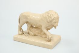 A STAFFORDSHIRE SALT-GLAZED MODEL OF A LION, 19TH CENTURY
