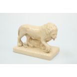 A STAFFORDSHIRE SALT-GLAZED MODEL OF A LION, 19TH CENTURY