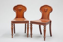 A PAIR OF MAHOGANY HALL CHAIRS, MID 19TH CENTURY