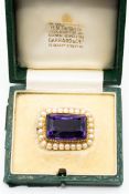 AN AMETHYST AND CULTURED PEARL BROOCH