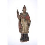 A CONTINENTAL CARVED POLYCHROME WOODEN FIGURE OF A BISHOP, PROBABLY 18th CENTURY